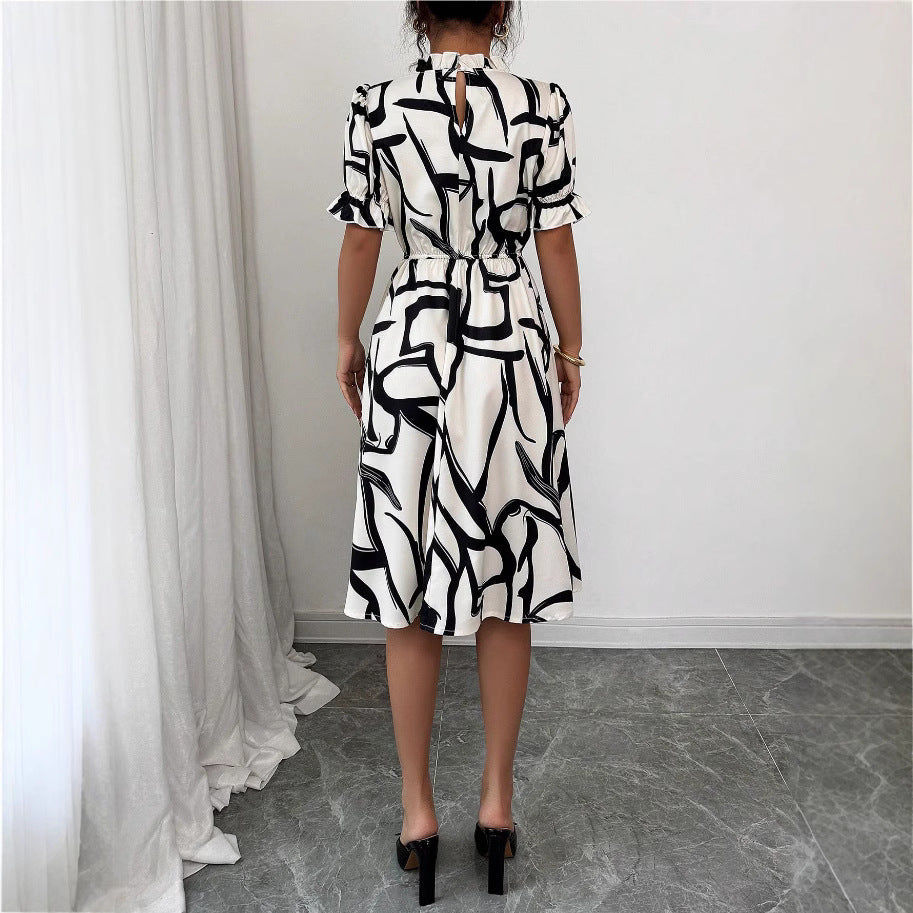 Robe midi élégante pour femmes avec motif de plantes stylé et taille élastique Chic & Stil