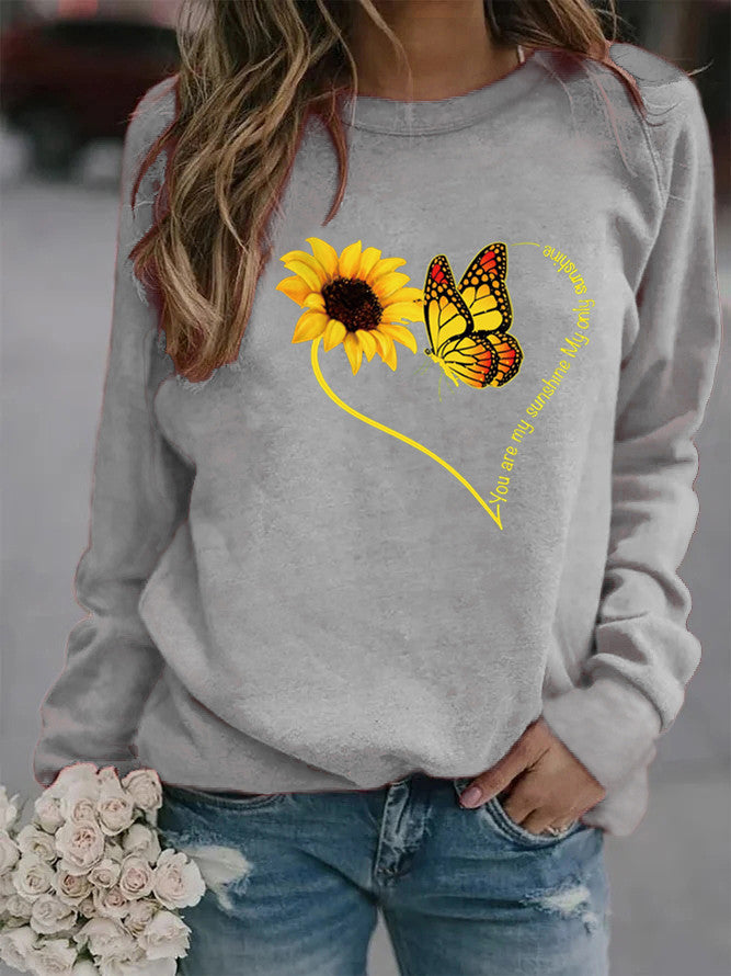 Sweatshirt pour femmes avec motif graphique de papillon et de tournesol Chic & Stil