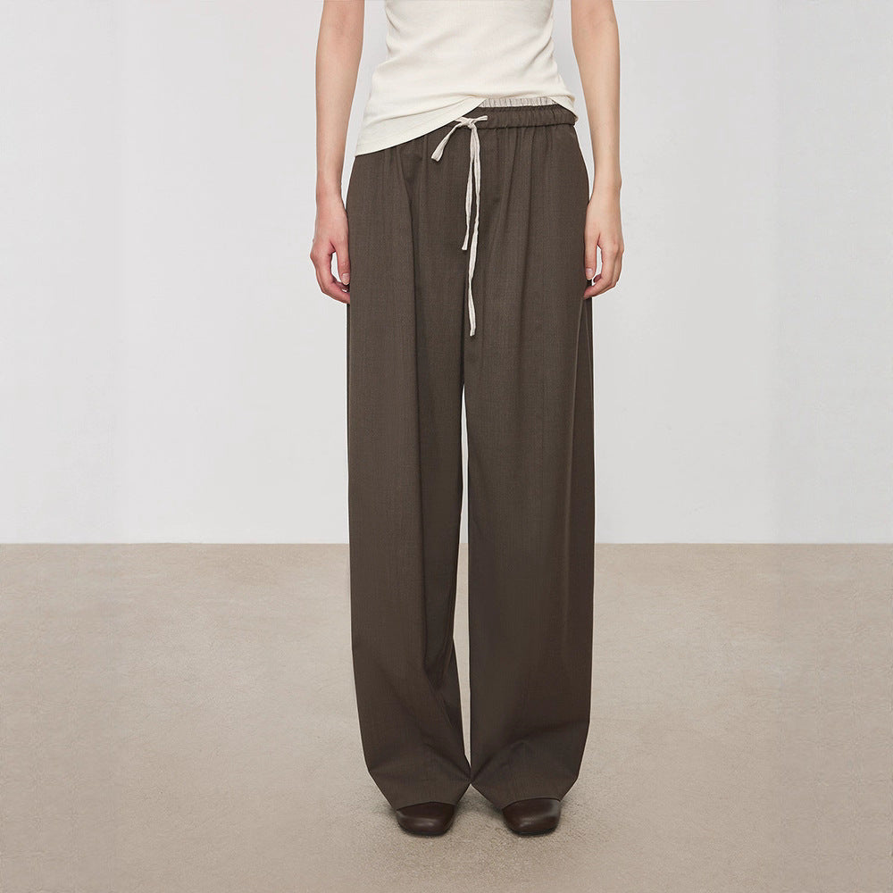 Pantalons en tissu large pour femmes avec taille élastique et poches pratiques Chic & Stil