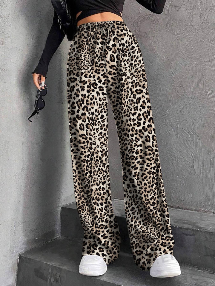 Pantalons plissés à coupe large pour femmes avec taille élastique et poches latérales pratiques Chic & Stil