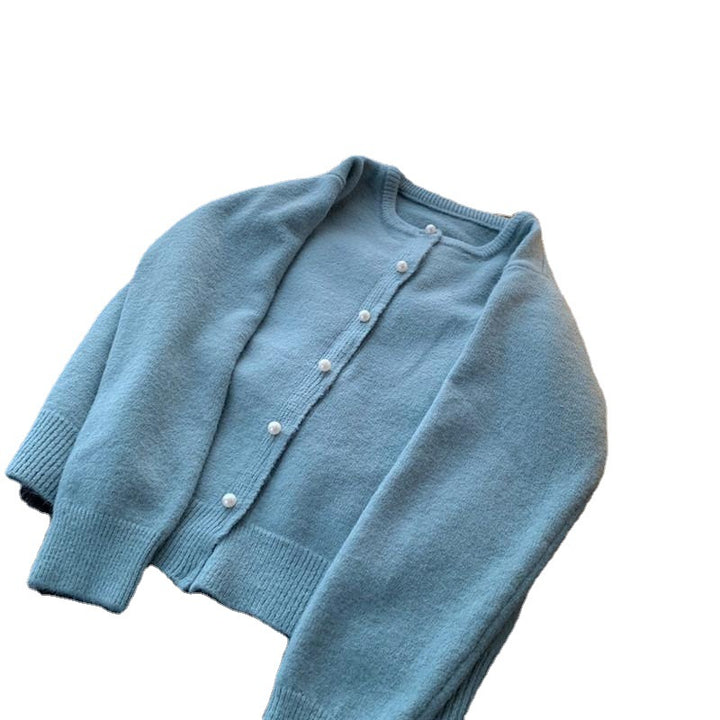 Cardigan femme avec élégants boutons en perles et design moderne Chic & Stil