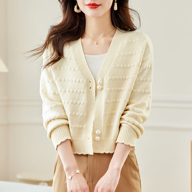 Ladies comfortable knit jacket with pearl adorned buttons and structured design Lune London