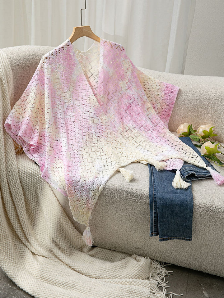 Airy knitted poncho for ladies with decorative fringes Lune London