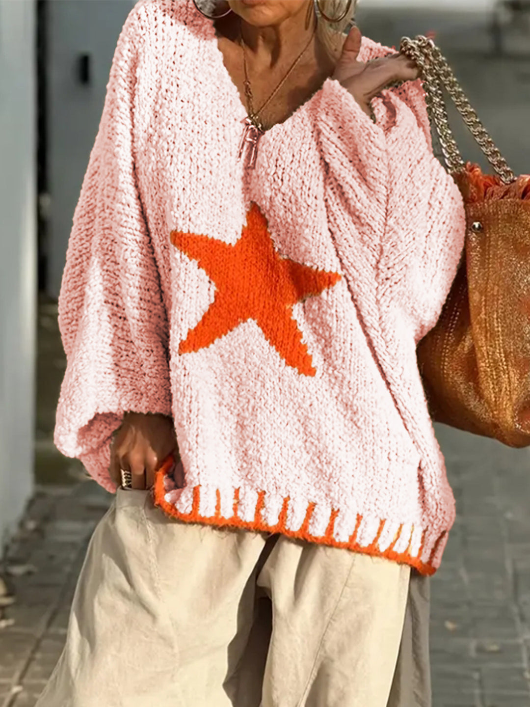 Women's knitted sweater with V-neck and striking star pattern Lune London