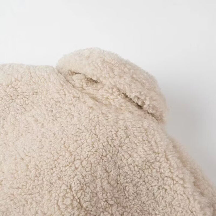 Fluffy teddy coat for women with elegant lapels and practical piped pockets Lune London