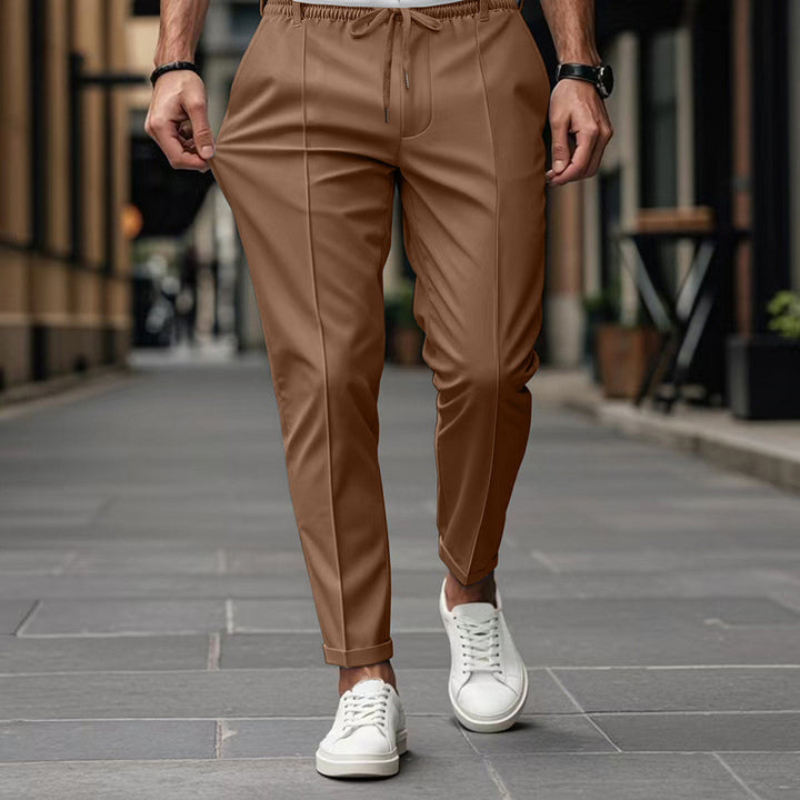 Men's fashionable sports pants with elastic waistband and practical welt pockets Lune London