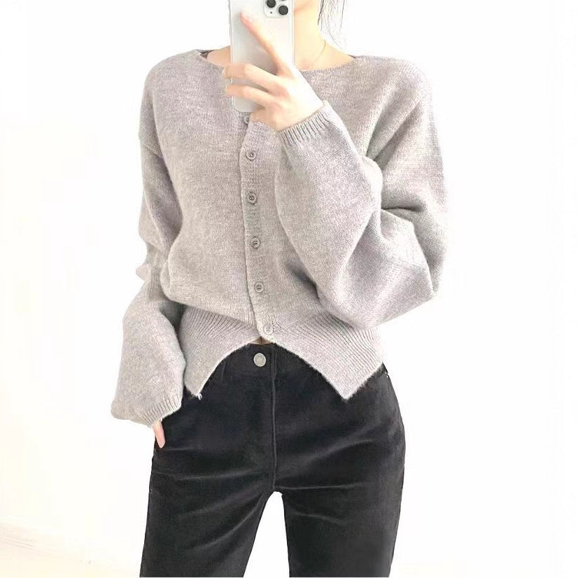 Pull cropped femme avec des détails de boutons et des manches surdimensionnées Chic & Stil