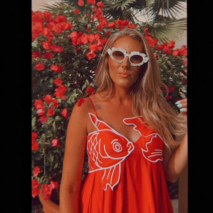 Maxi dress for women with a playful fishnet design and adjustable spaghetti straps Lune London