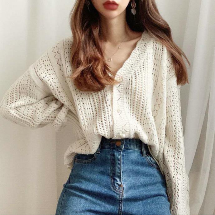 Thick knitted sweater for women with a trendy V-neck and chic button details