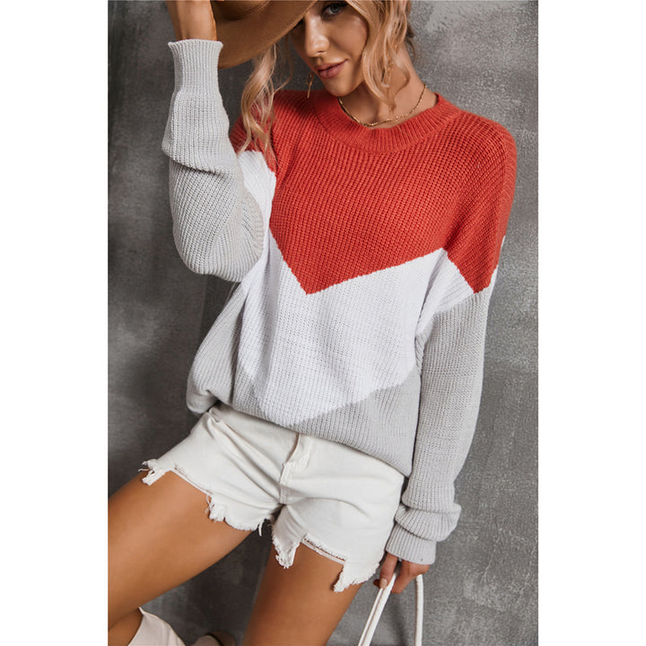 Femme pull en tricot à la mode avec un décolleté en V frappant et un design graphique Chic & Stil