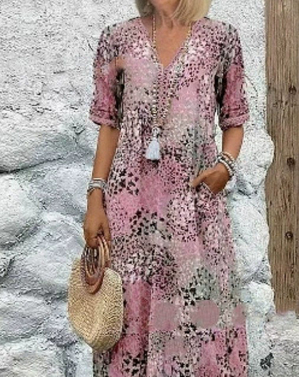 Maxi dress for women with V-neckline and practical side pockets Lune London
