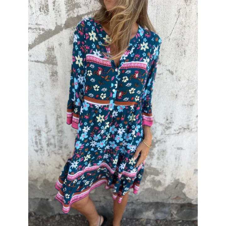 Casual blouse dress for women with a colorful floral pattern and a flared knee hem Lune London