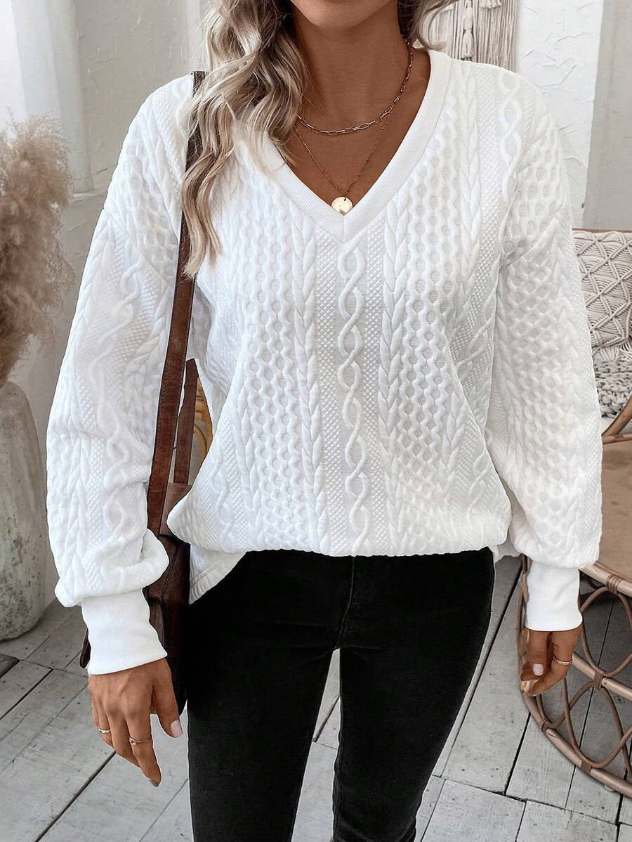Knit sweater for women with a deep V-neck and a textured pattern Lune London