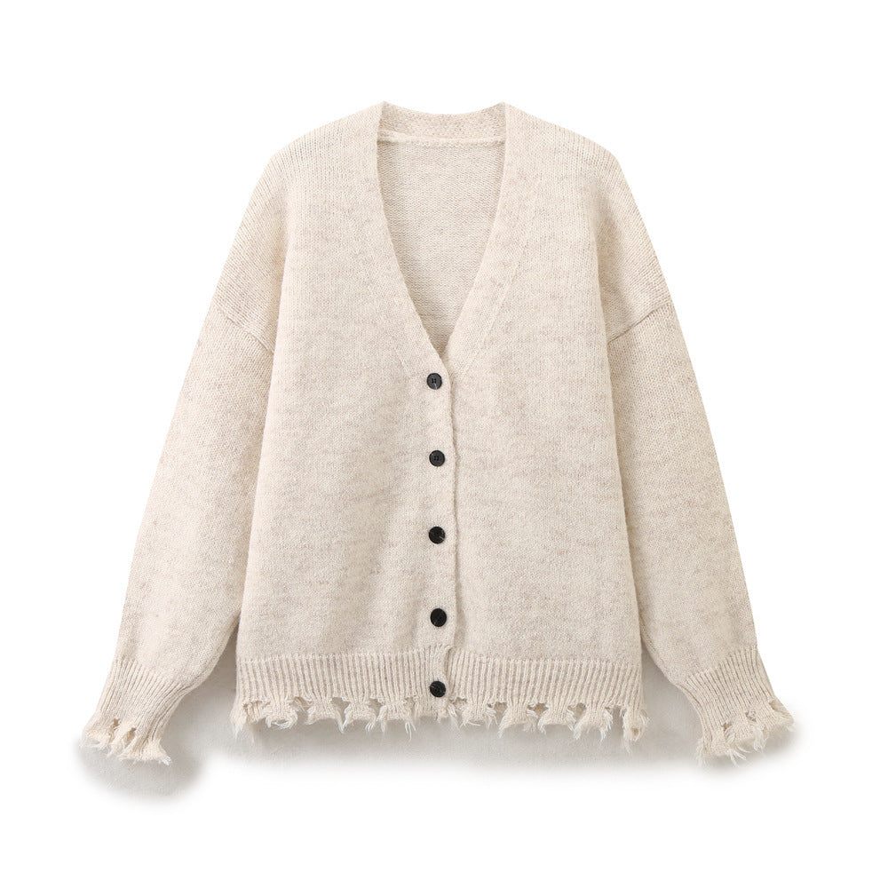 Casual knitted jacket for women with fringed hem and button closure Lune London