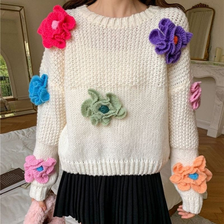 Women’s knitted sweater with chic floral appliqués and style
