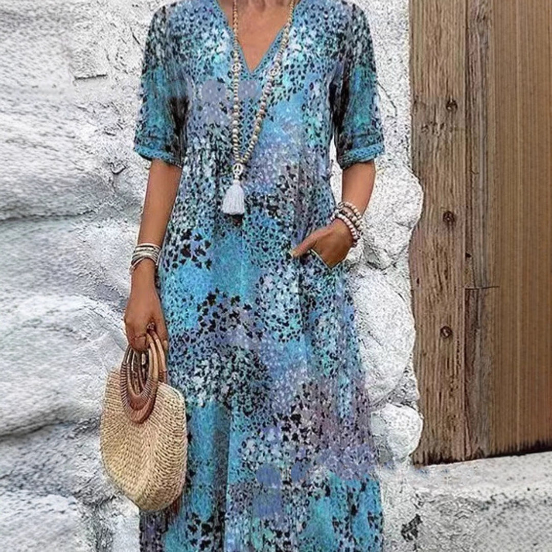 Maxi dress for women with V-neckline and practical side pockets Lune London