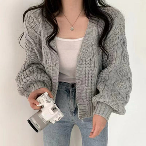 Thick knitted jacket for women with voluminous sleeves and a unique cable pattern Lune London