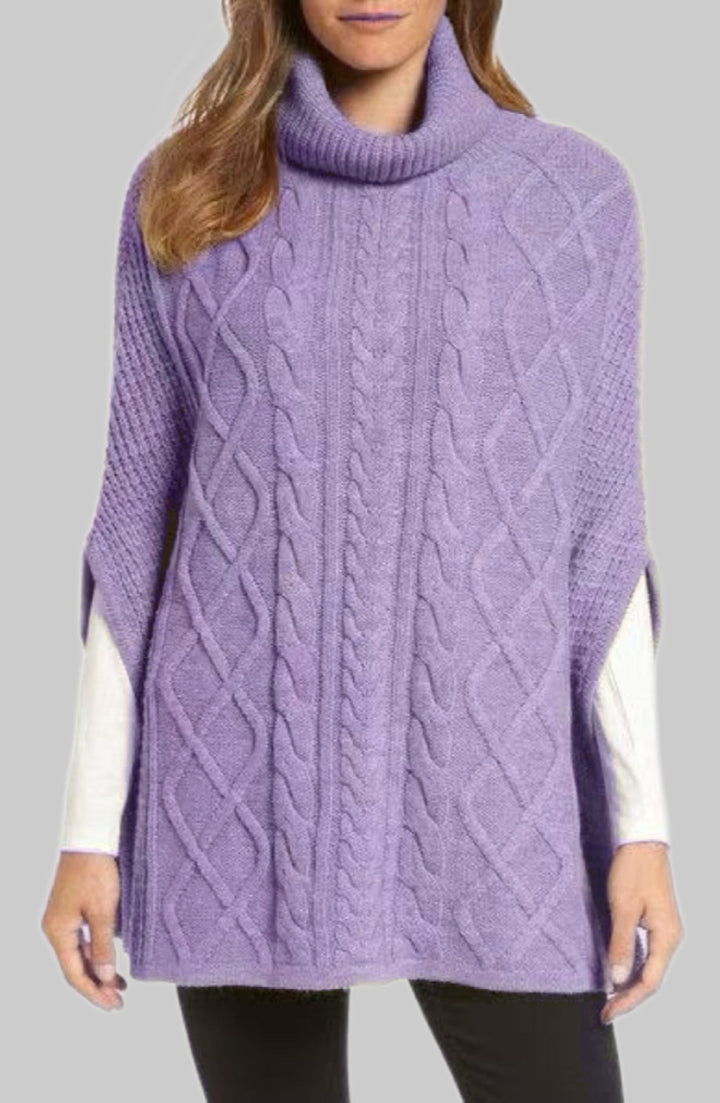 Knitted poncho for women with high collar and classic cable knit pattern Lune London
