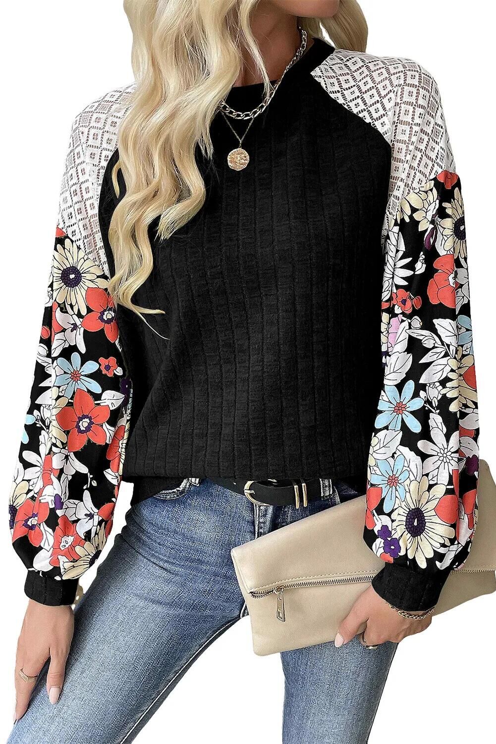 Women's sweater with a playful shape featuring a chic floral sleeve design