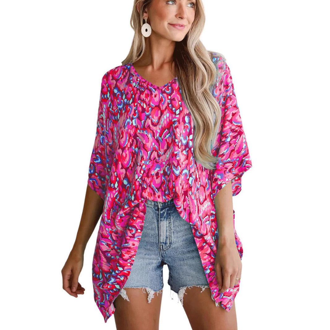 Casual beach blouse for women with an asymmetrical cut and colorful pattern Lune London