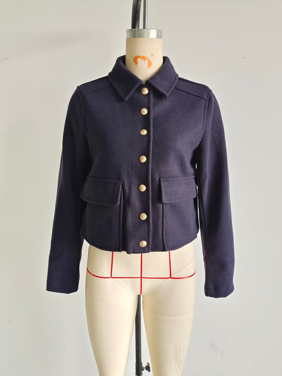 Short trendy jacket for ladies with practical pockets and gold buttons Lune London