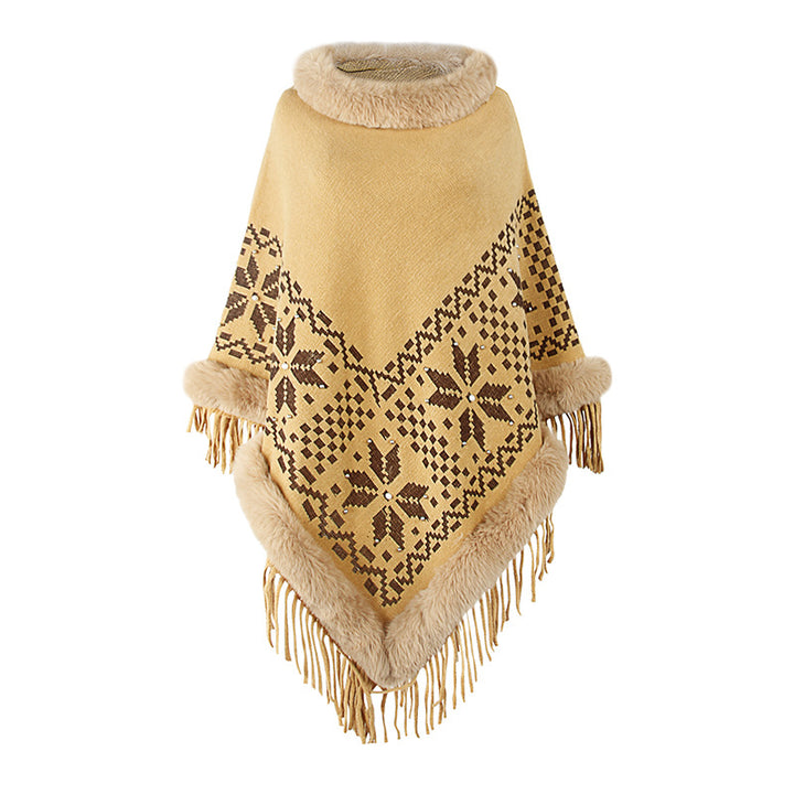 Elegant women's poncho with decorative fringe design and faux fur trim Lune London