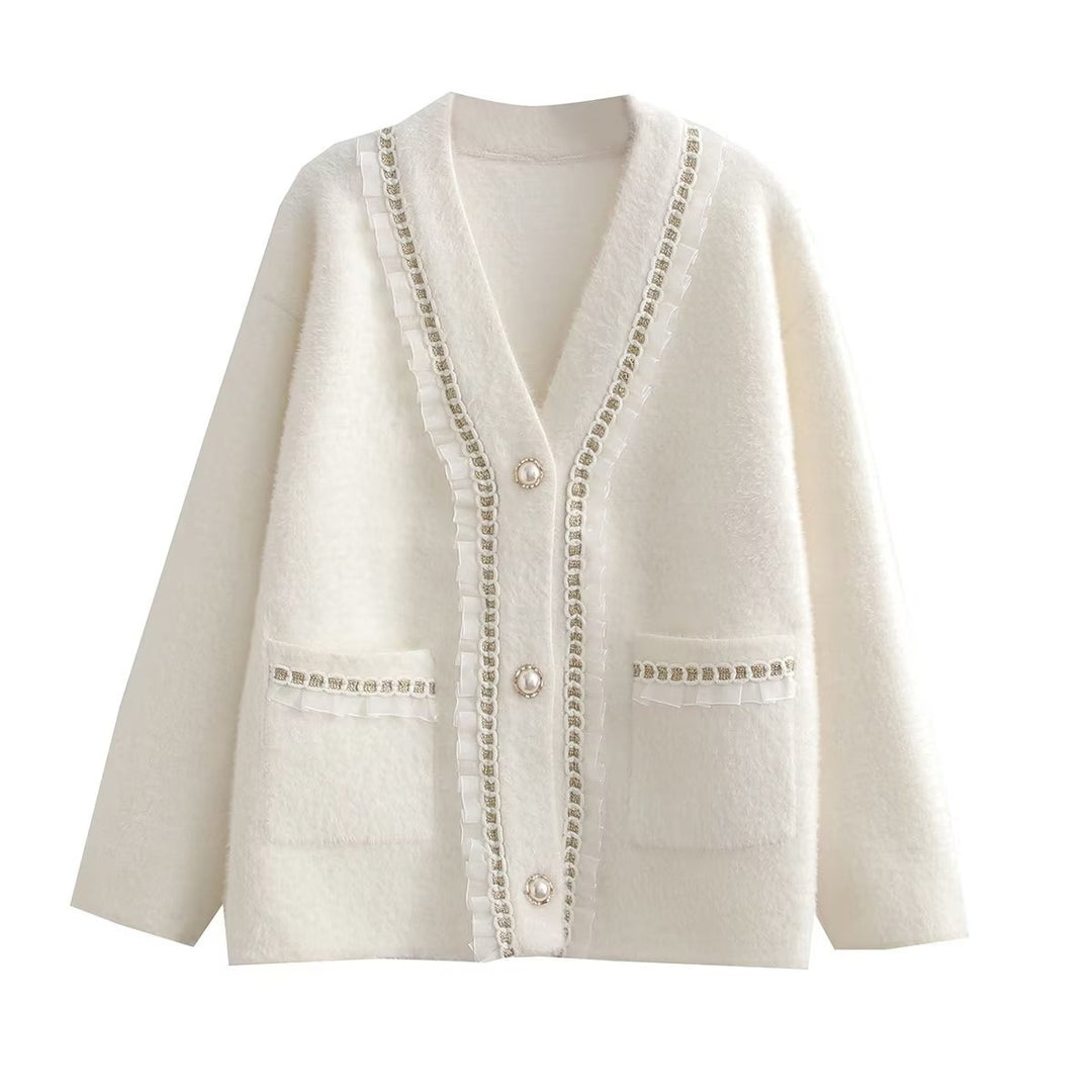 Fashionable women's knitted jacket with decorative ruffles and button details adorned with pearls Lune London