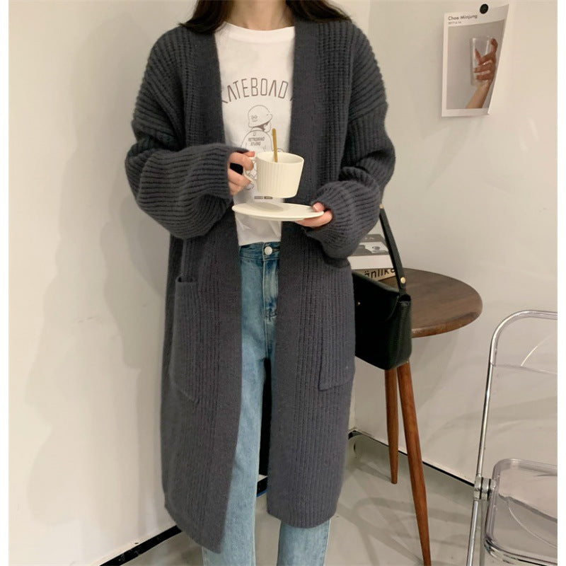 Cardigan en tricot grande taille pour femmes avec coupe décontractée et poches Chic & Stil