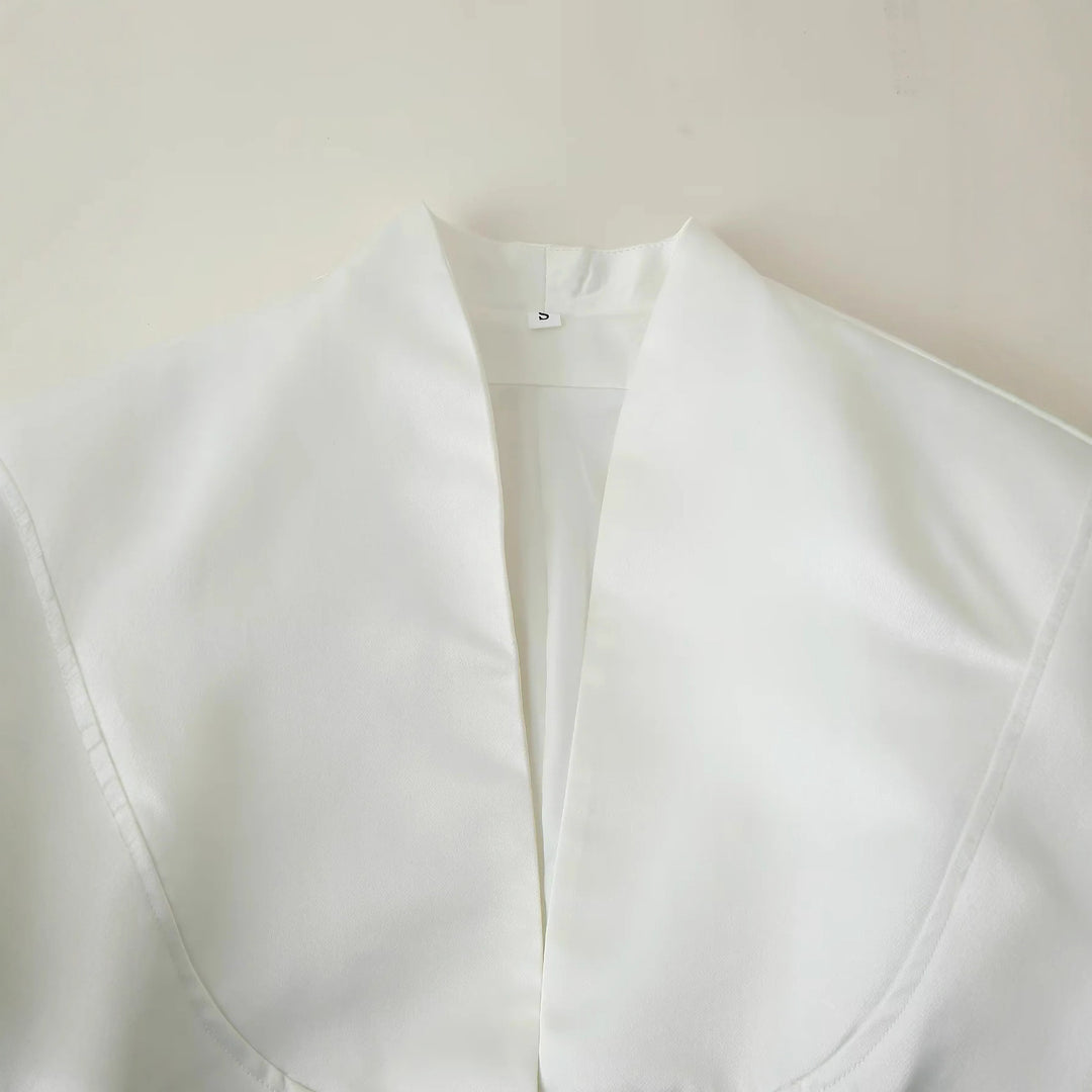 Elegant blazer jacket for women with a fashionable high collar and decorative button details Lune London