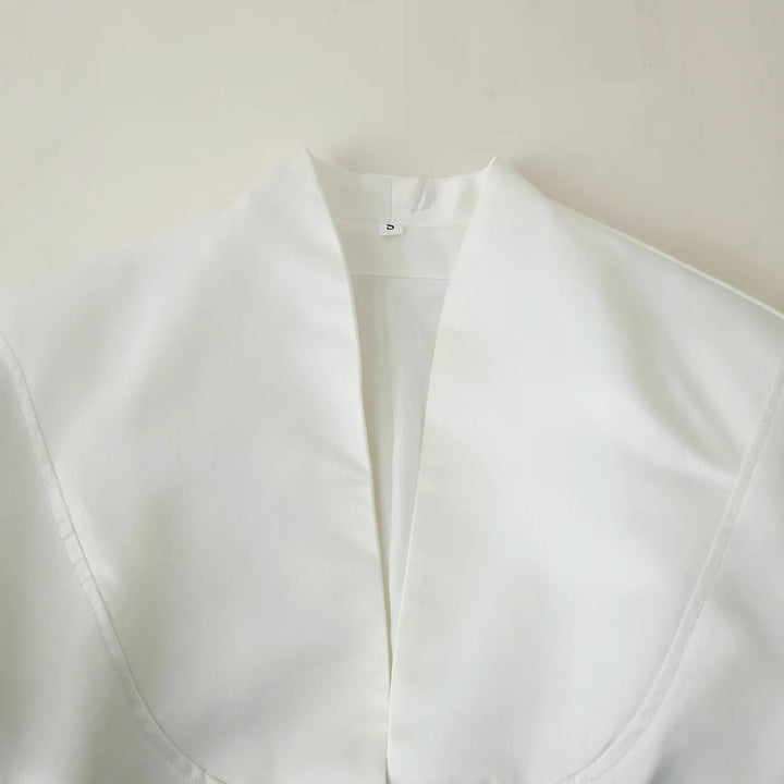 Elegant blazer jacket for women with a fashionable high collar and decorative button details Lune London