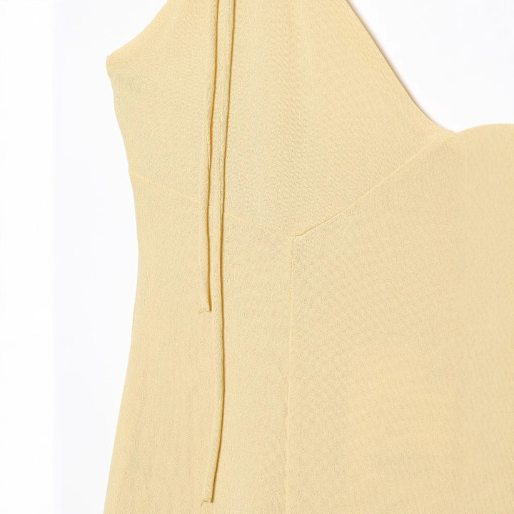 Maxi dress for women with voluminous ruffle details and adjustable spaghetti straps Lune London