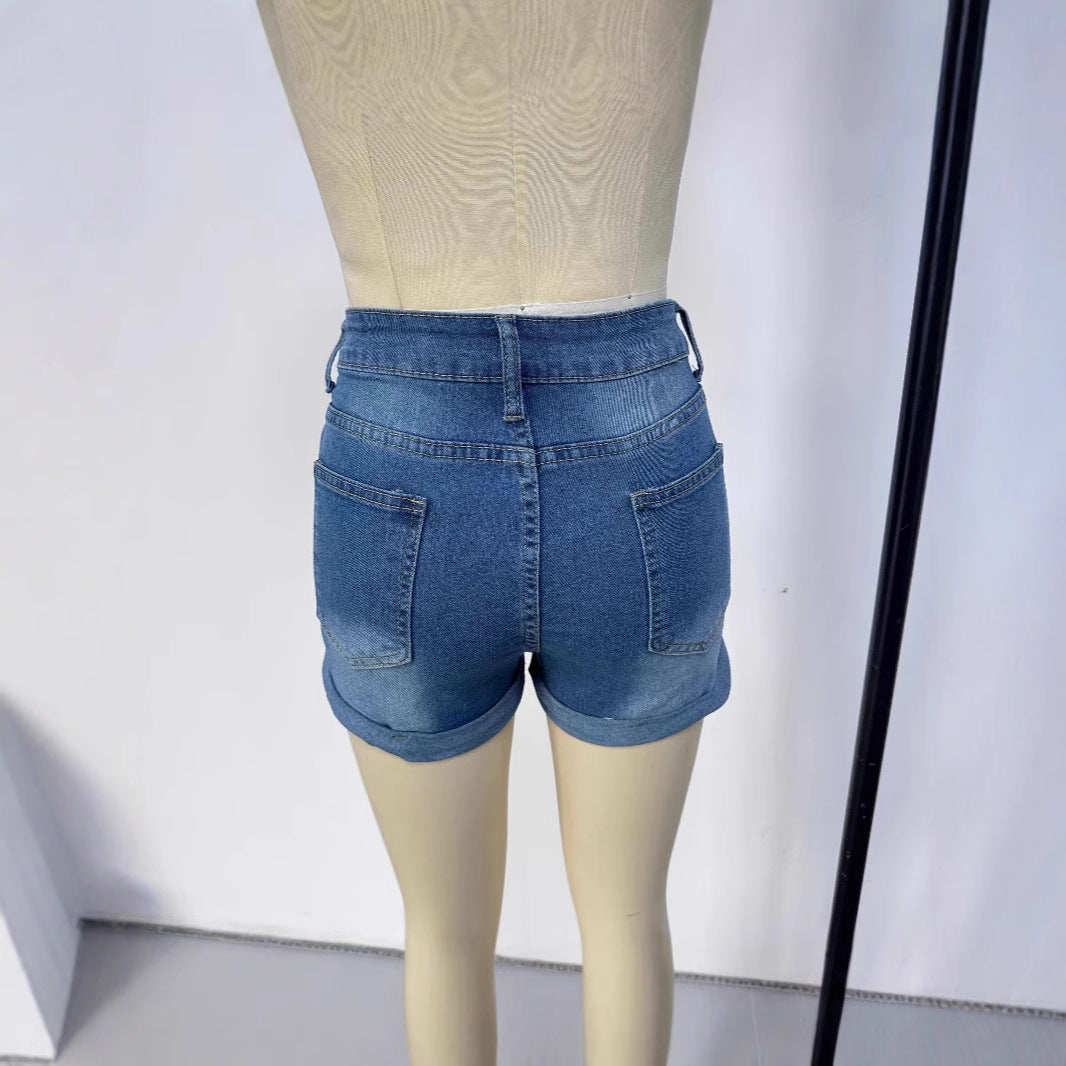 Women's short destroyed denim shorts in a casual look with rolled hems and stylish ripped details Lune London