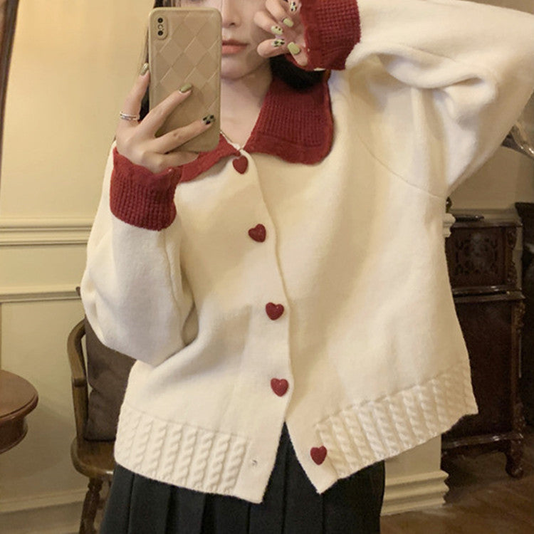 Knitted women's jacket with heart-shaped buttons and a distinctive ruffle collar Lune London