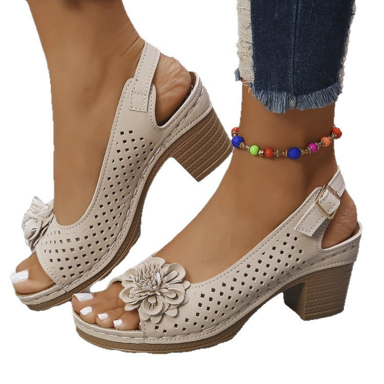 Women's clogs with a decorative floral detail and a perforated surface Lune London