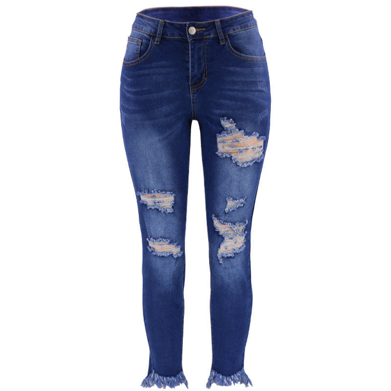 High-waisted jeans for women with a modern destroyed look featuring a trendy frayed hem Lune London