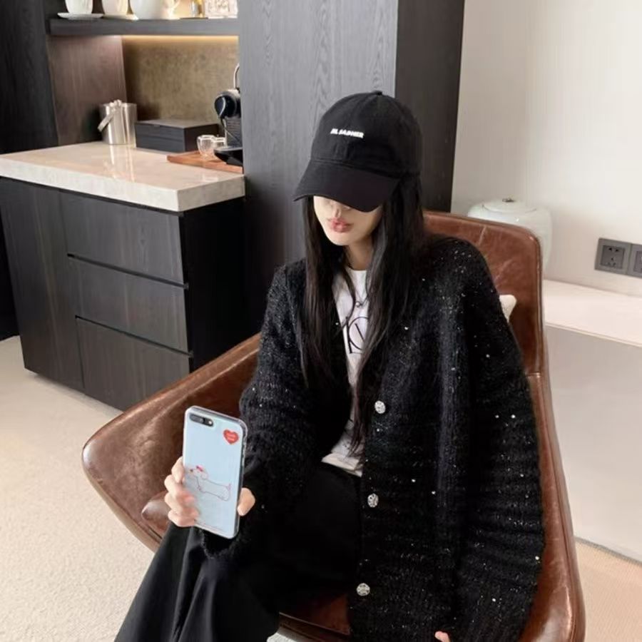 Knitted jacket for women with voluminous sleeves and a unique mesh structure Lune London