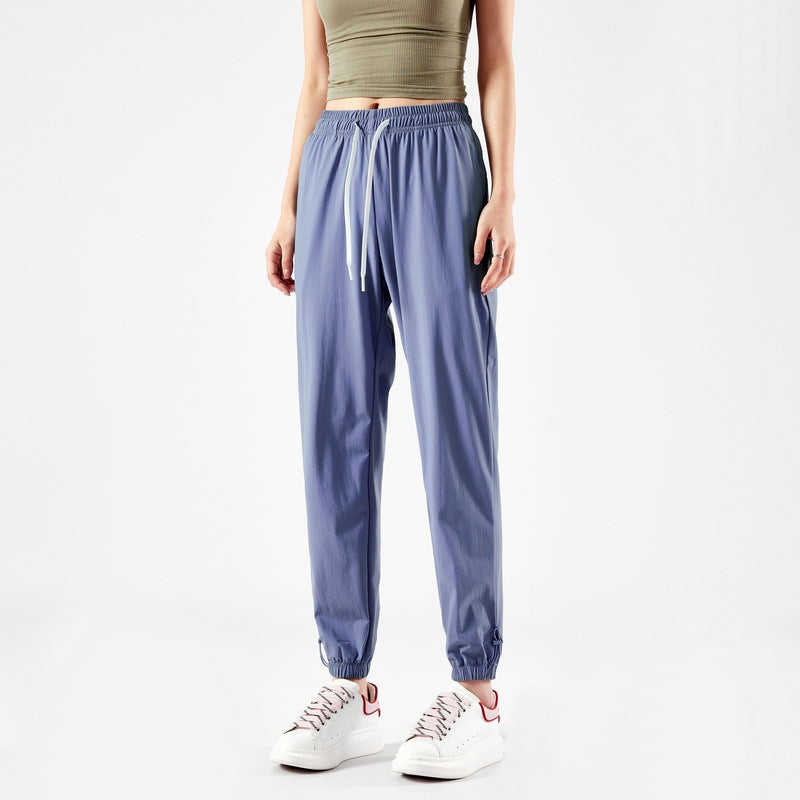 Light sport pants for women with elastic waist and practical pockets Lune London