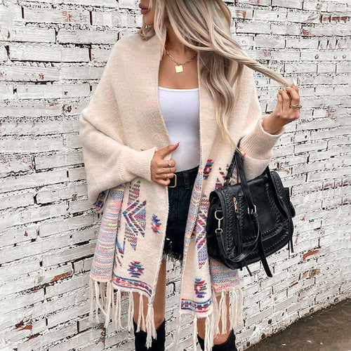 Wool poncho for women with colorful Navajo pattern and fringed hem Lune London