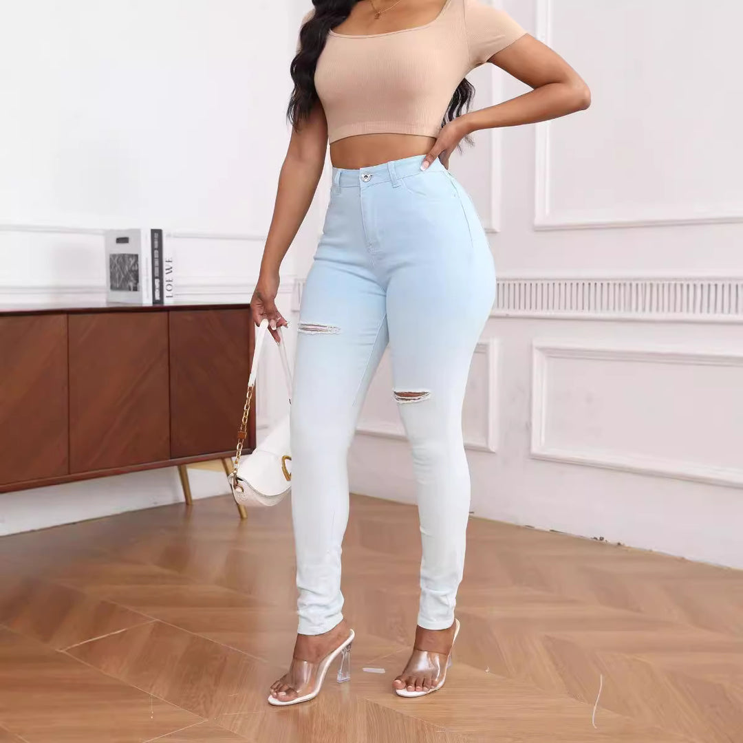 High-waisted women's fitted jeans with stylish ripped details Lune London