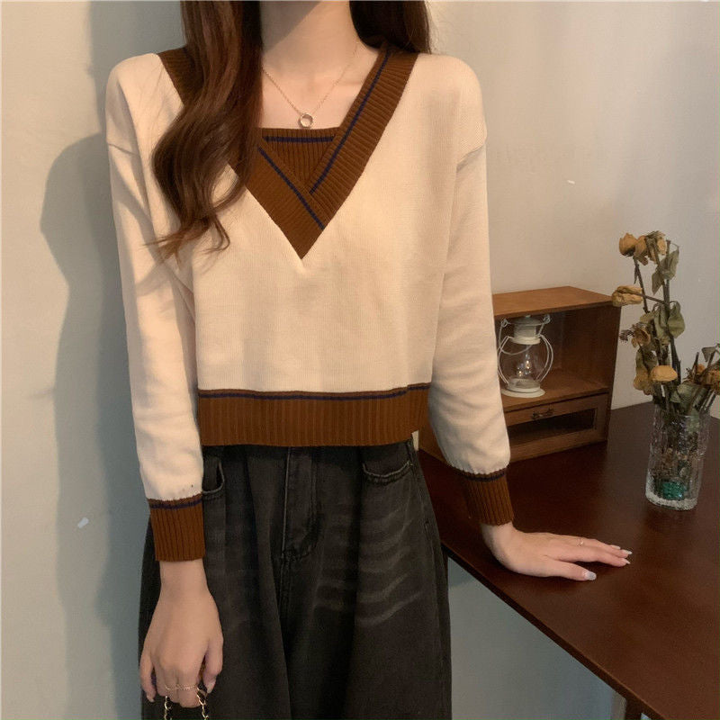 Pull féminin à la mode en V avec détails contrastés Chic & Stil