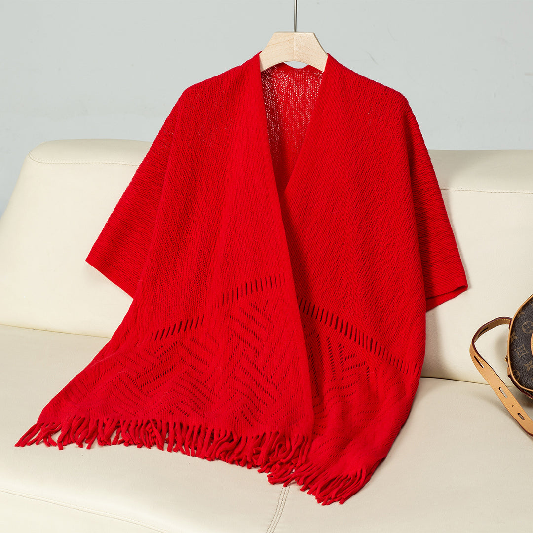 Elegant knitted poncho for women with fringe details and a distinctive pattern Lune London