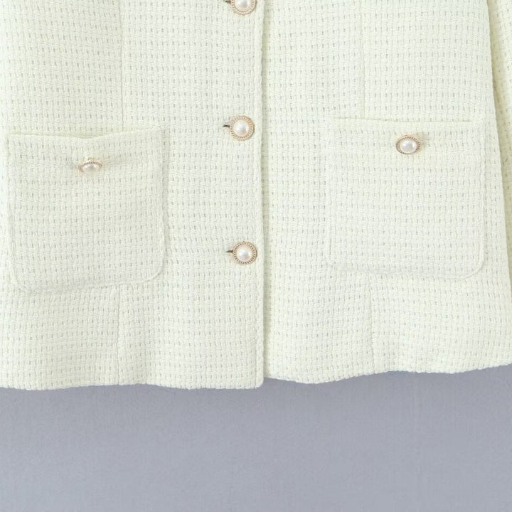 Ladies elegant knitted vest with textured design and pearl buttons Lune London
