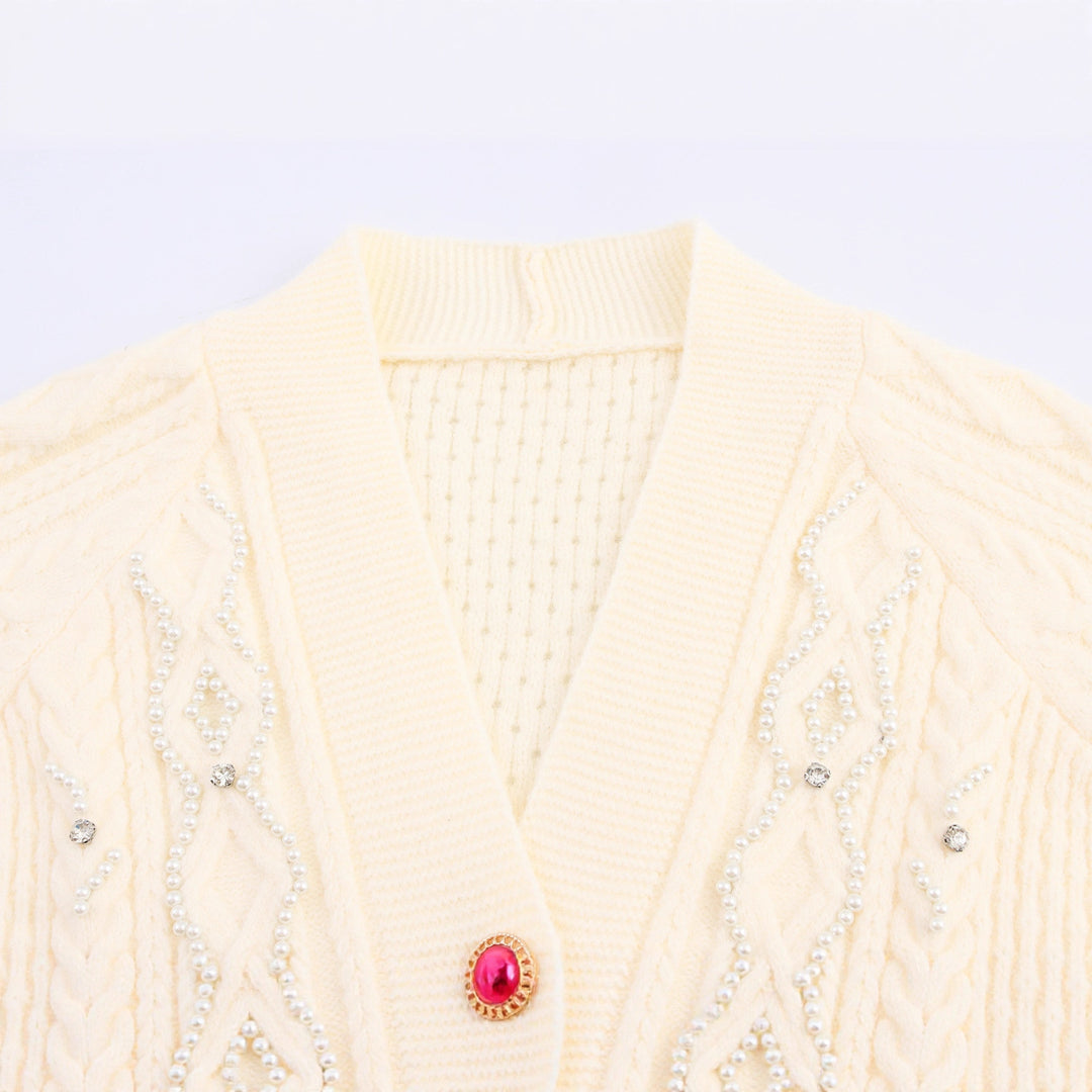 Knitted jacket for women with cable pattern and decorative button details Lune London