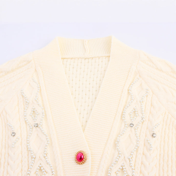 Knitted jacket for women with cable pattern and decorative button details Lune London