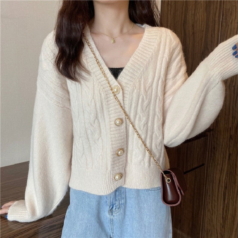 Knitted jacket for women with an elegant braid pattern and high-quality button details Lune London