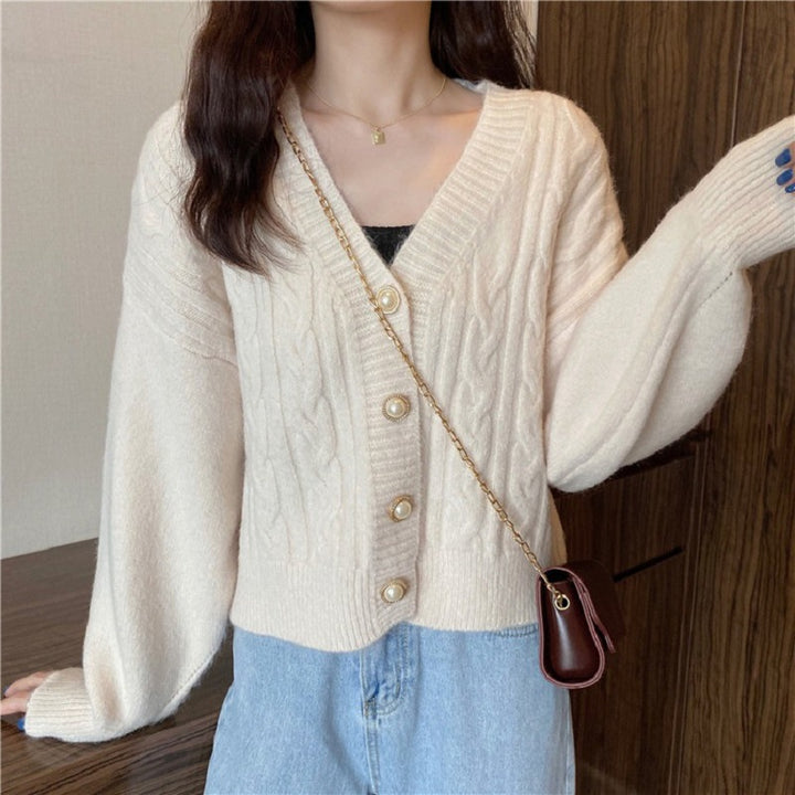 Knitted jacket for women with an elegant braid pattern and high-quality button details Lune London