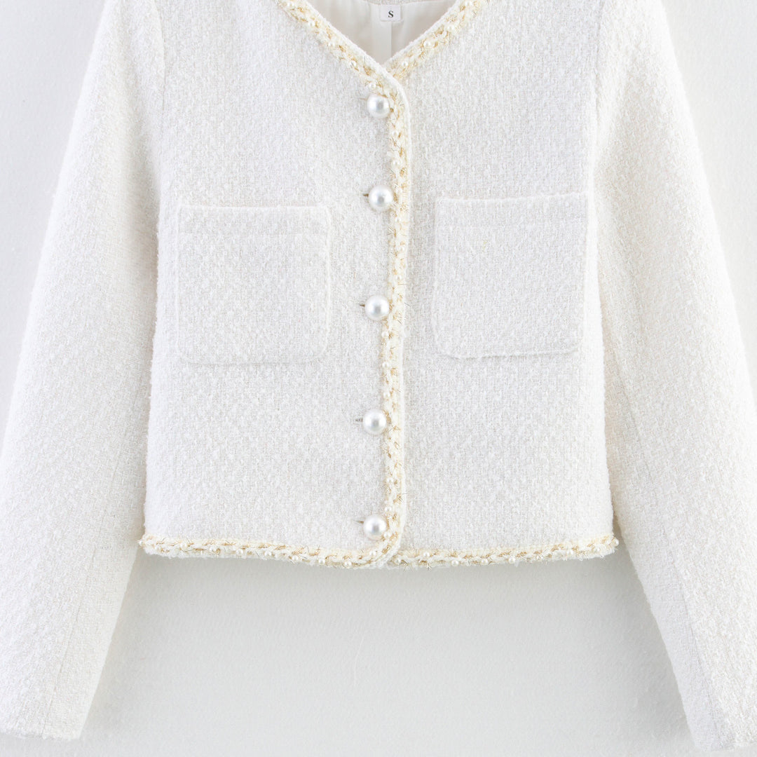 Trendy boucle jacket for ladies with elegant pockets and pearl embellished buttons Lune London