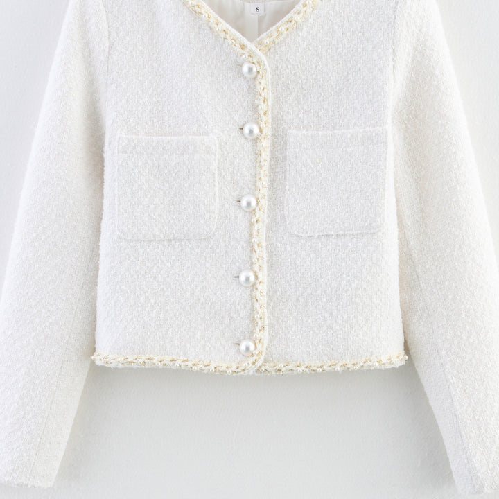 Trendy boucle jacket for ladies with elegant pockets and pearl embellished buttons Lune London