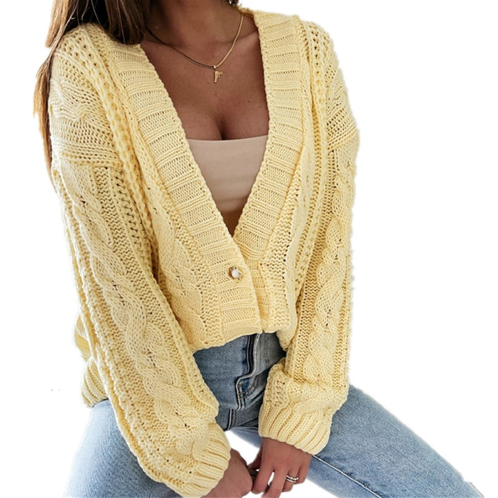Women's knitted jacket with decorative cable design and unique button details Lune London