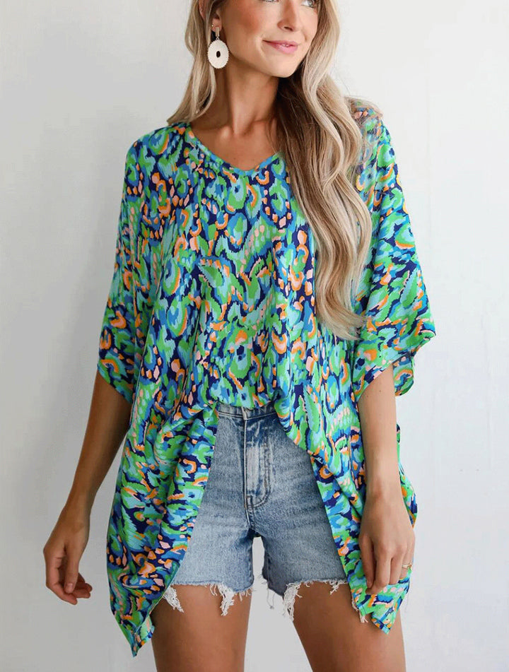 Casual beach blouse for women with an asymmetrical cut and colorful pattern Lune London